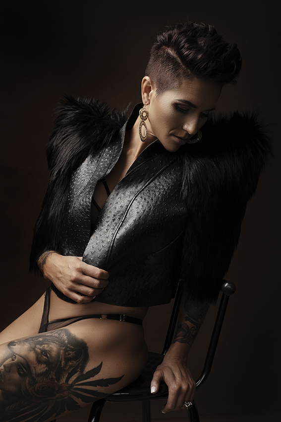 The best boudoir photography done by Loci Photography in Pretoria East showing a woman wearing a black jacket with short hair photographed in studio